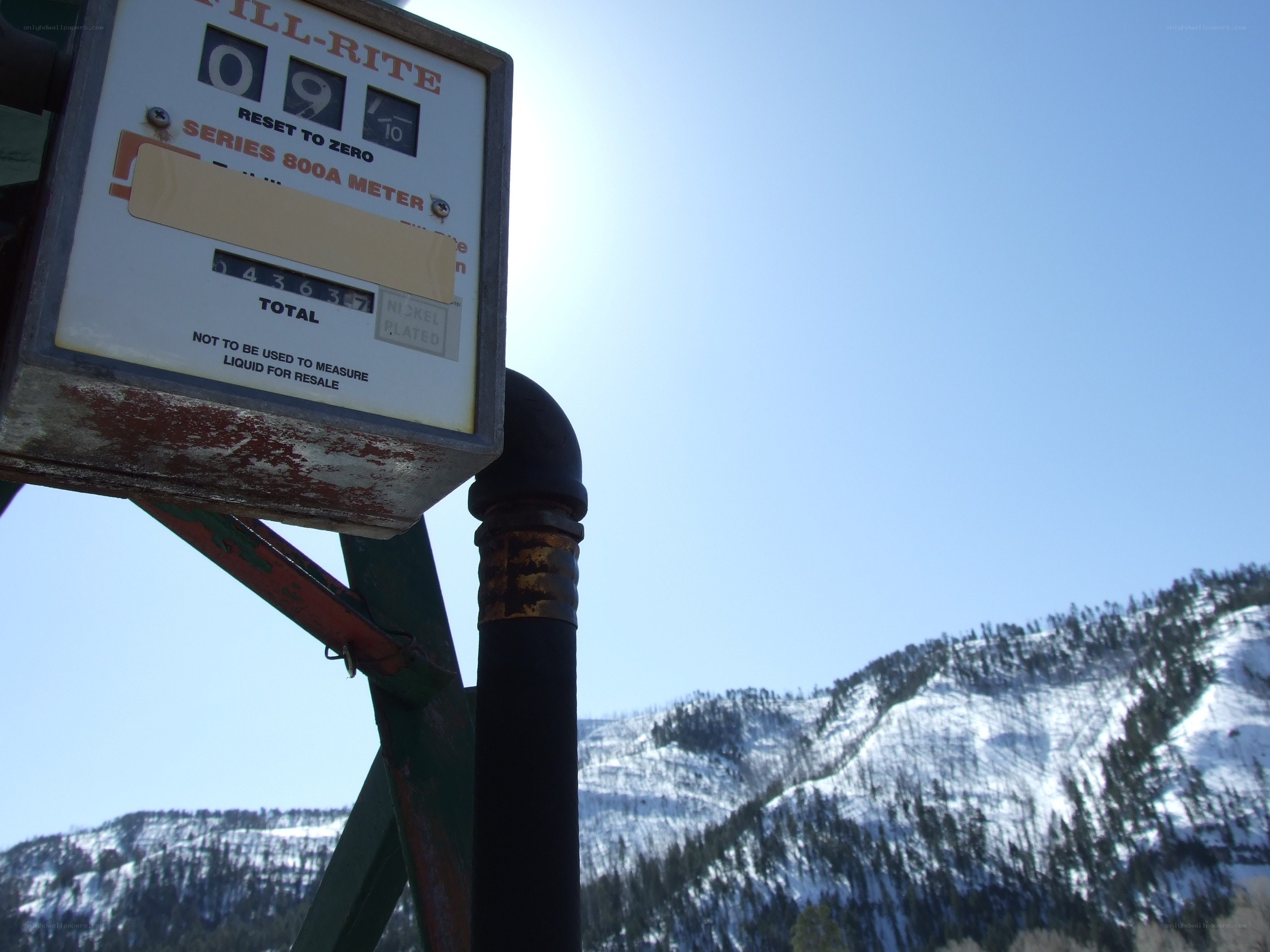 Fuel meter with snowy mountains