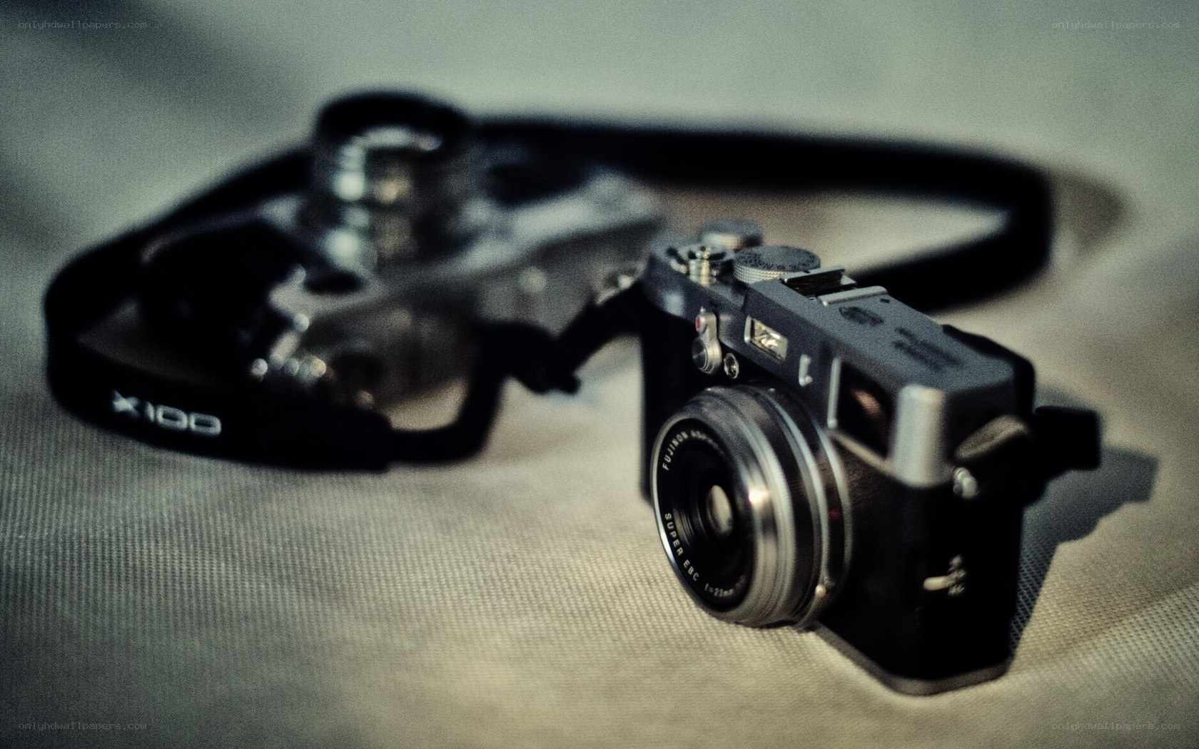 Fuji X100 camera on fabric