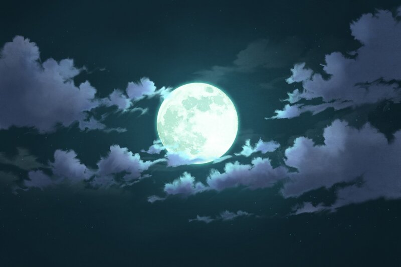 Full moon in cloudy night sky