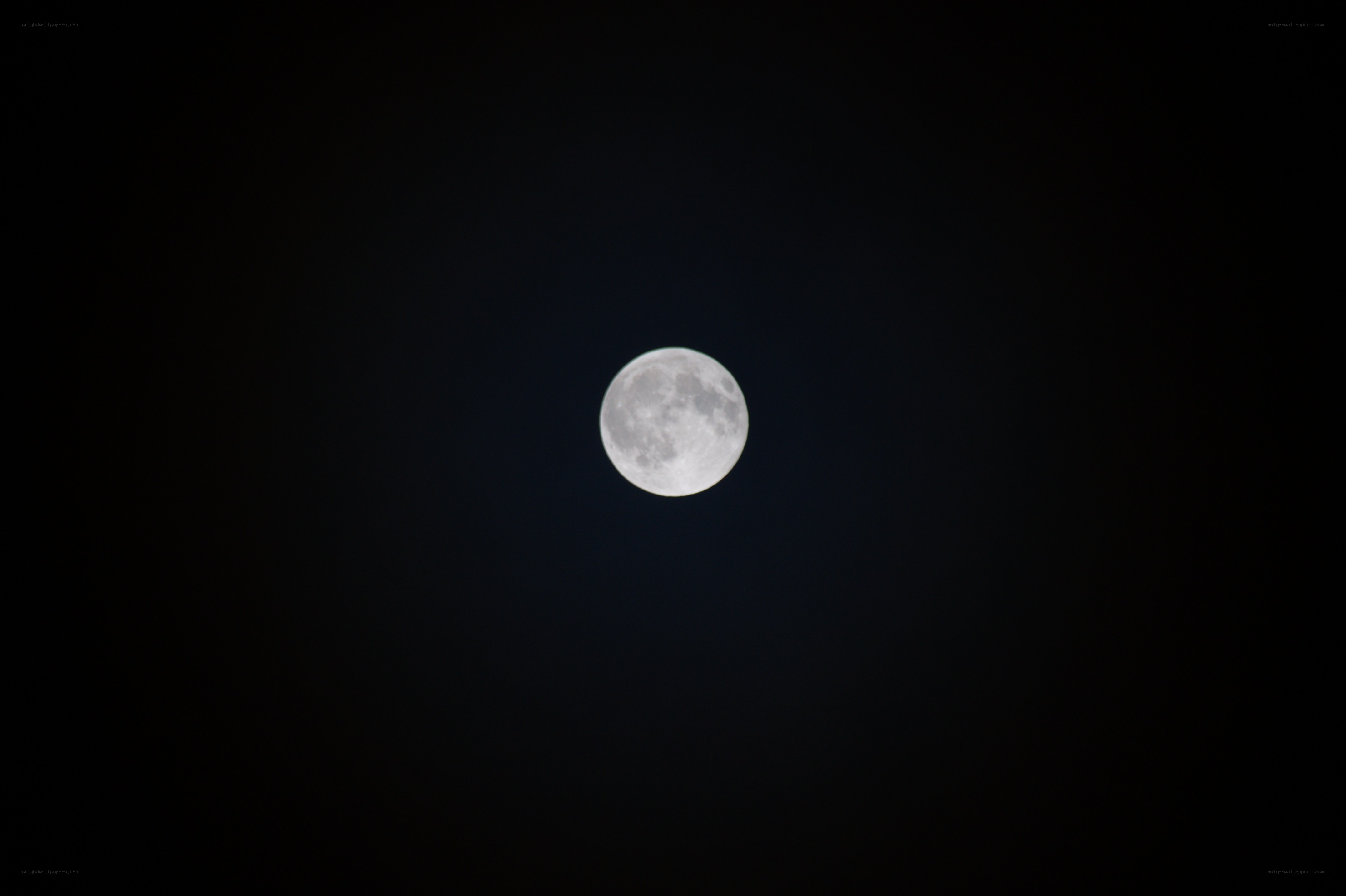 Full moon in dark sky