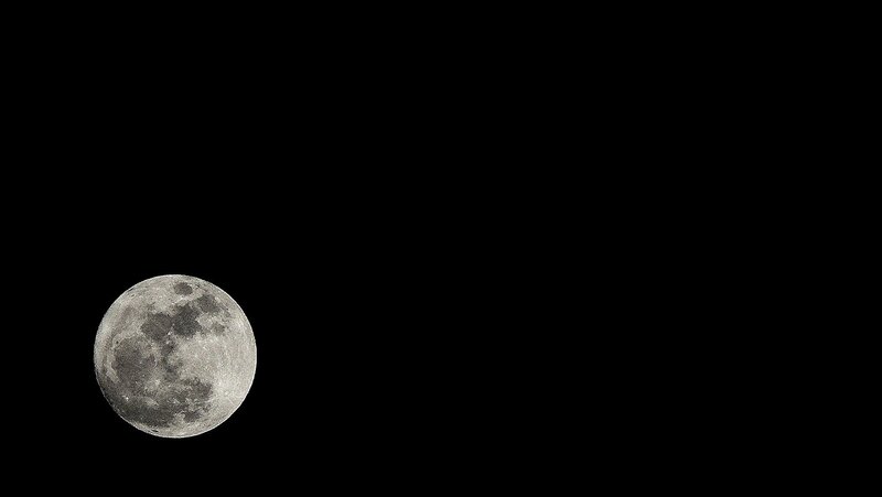 Full moon in dark sky