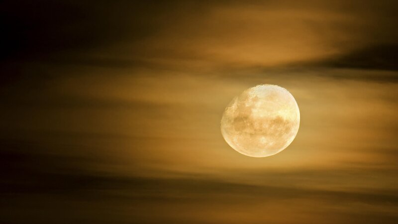 Full moon in golden sky