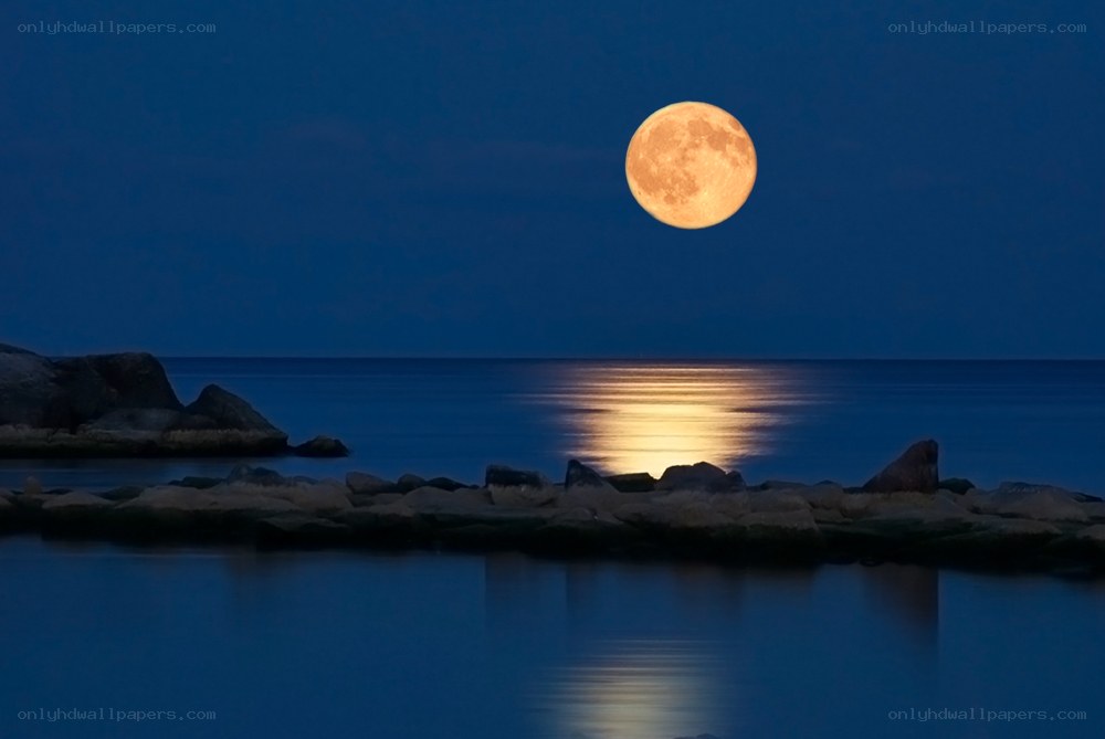 Full moon over calm sea