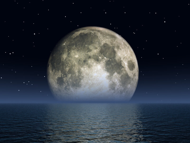 Full moon over calm sea