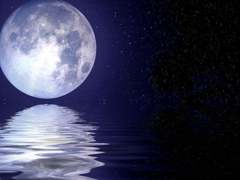 Full moon over calm water