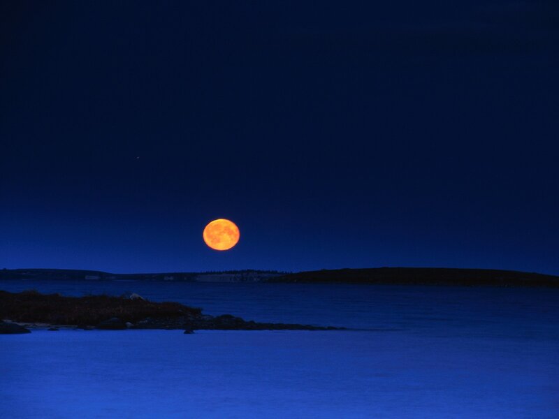 Full moon over coastal waters