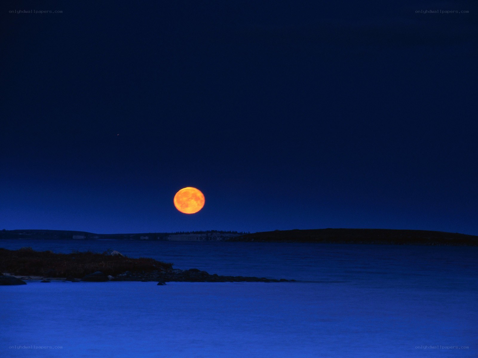 Full moon over coastal waters
