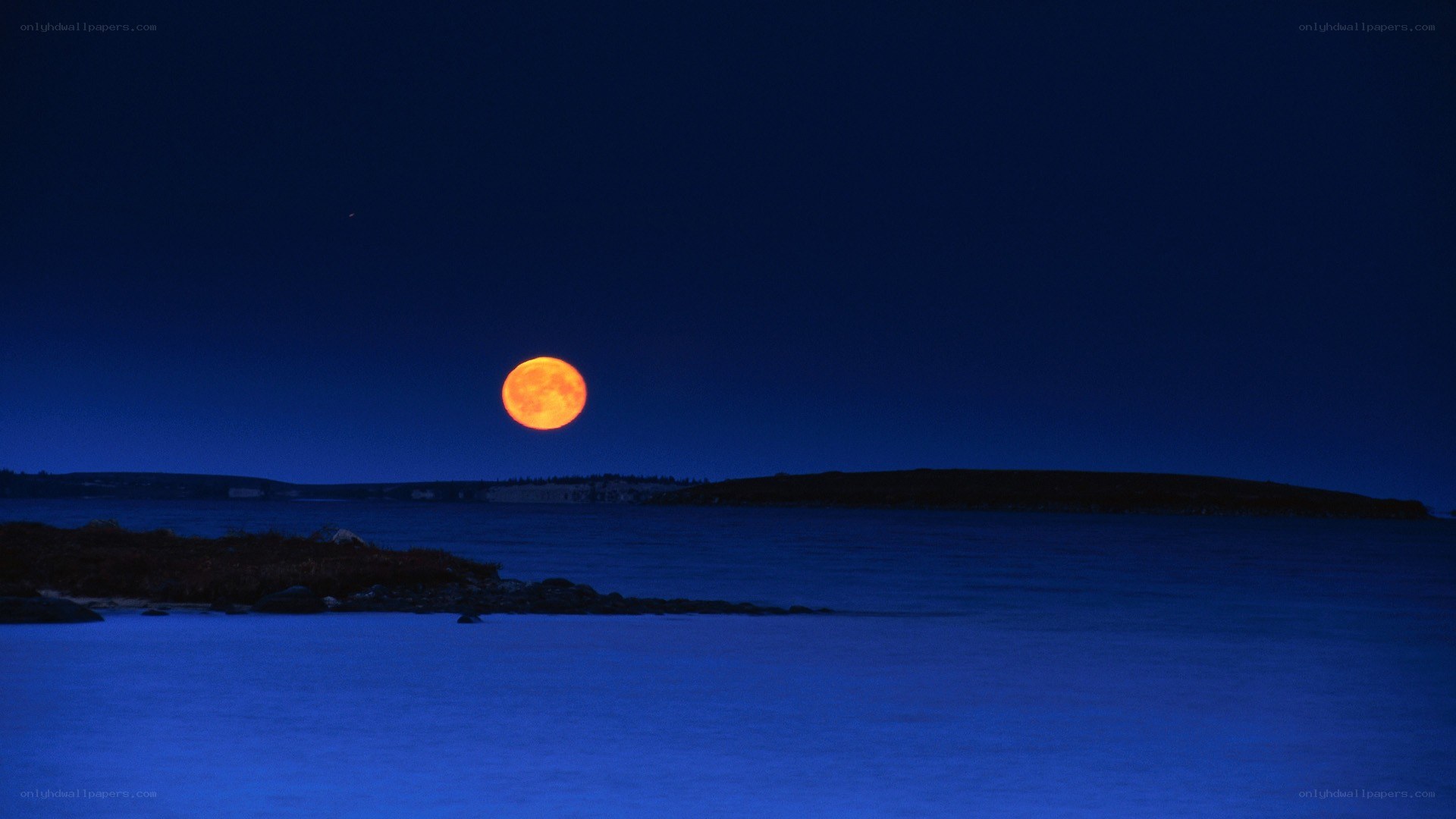 Full moon over coastal waters