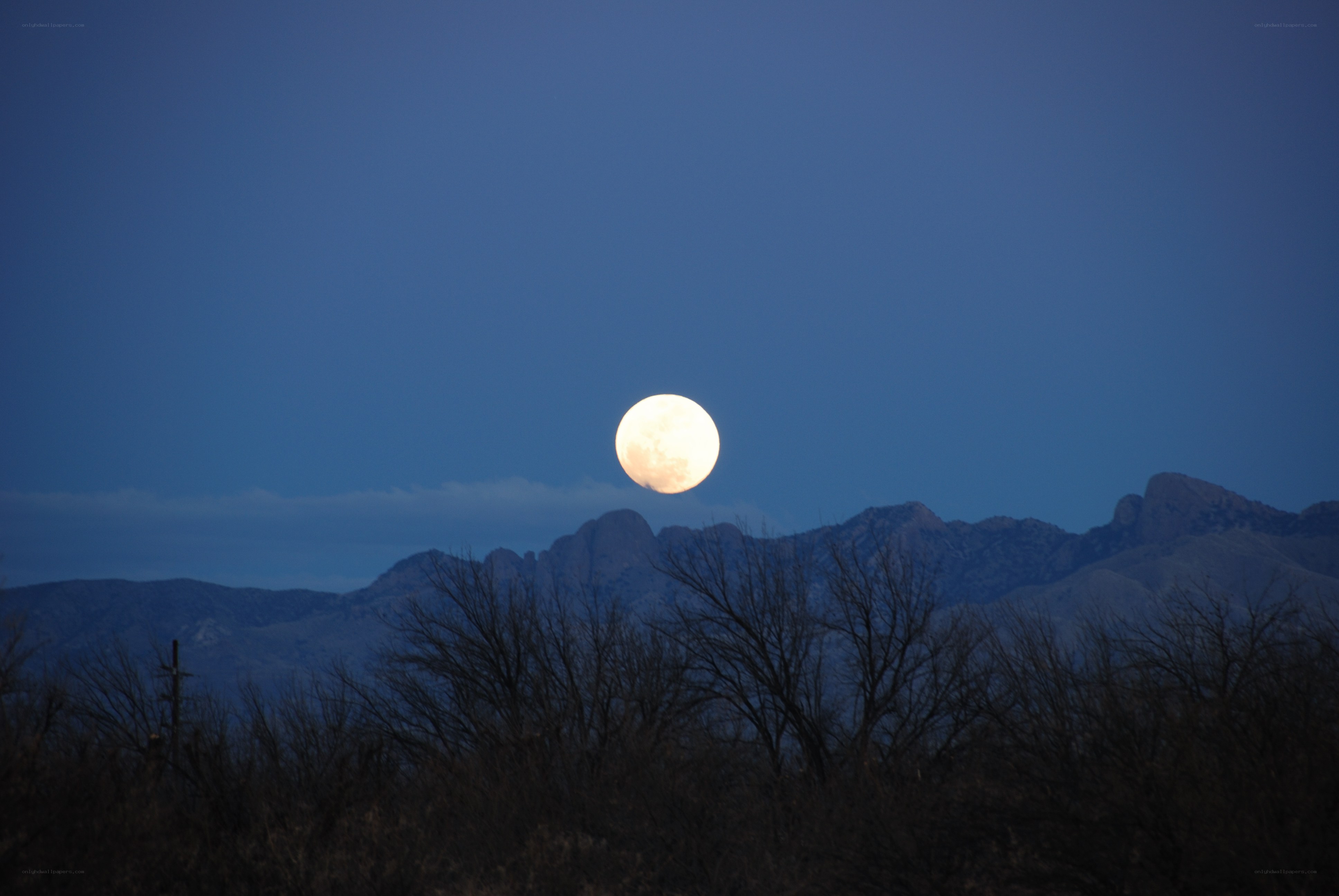 Full moon over mountains