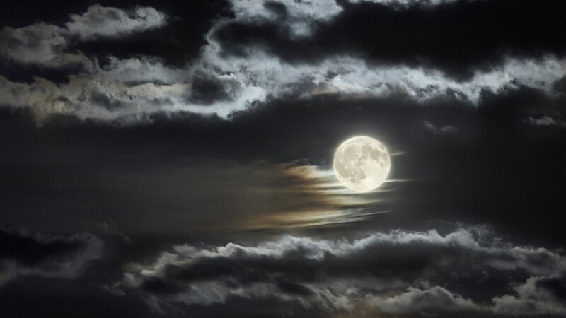Full moon through clouds