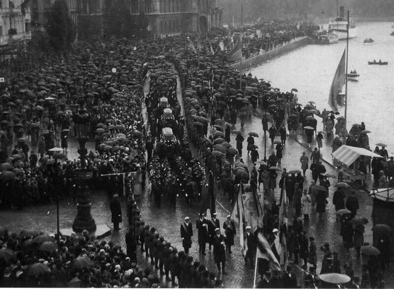 Funeral procession in rainy city