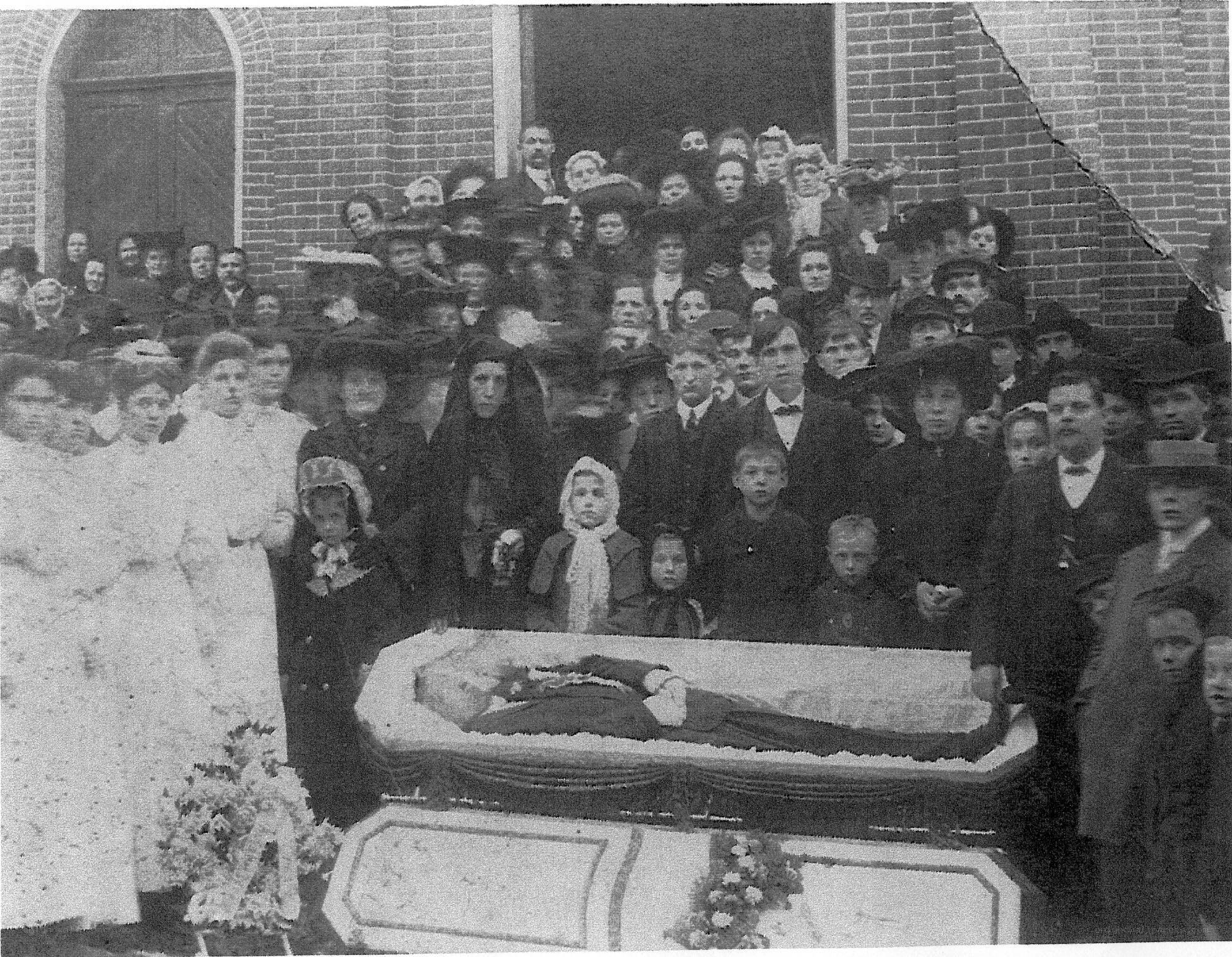 Funeral procession outside church
