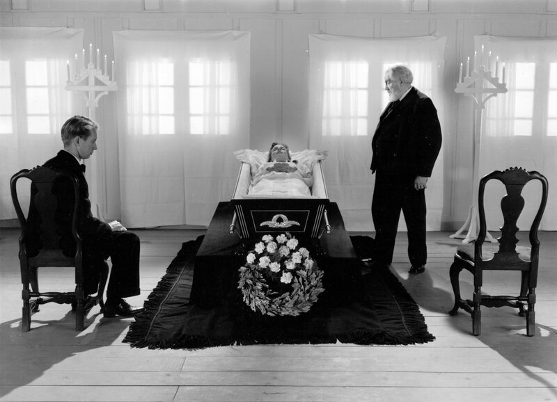 Funeral scene with coffin