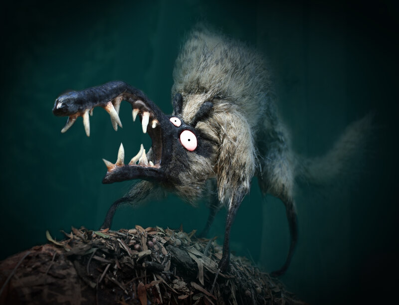 furry monster with sharp teeth