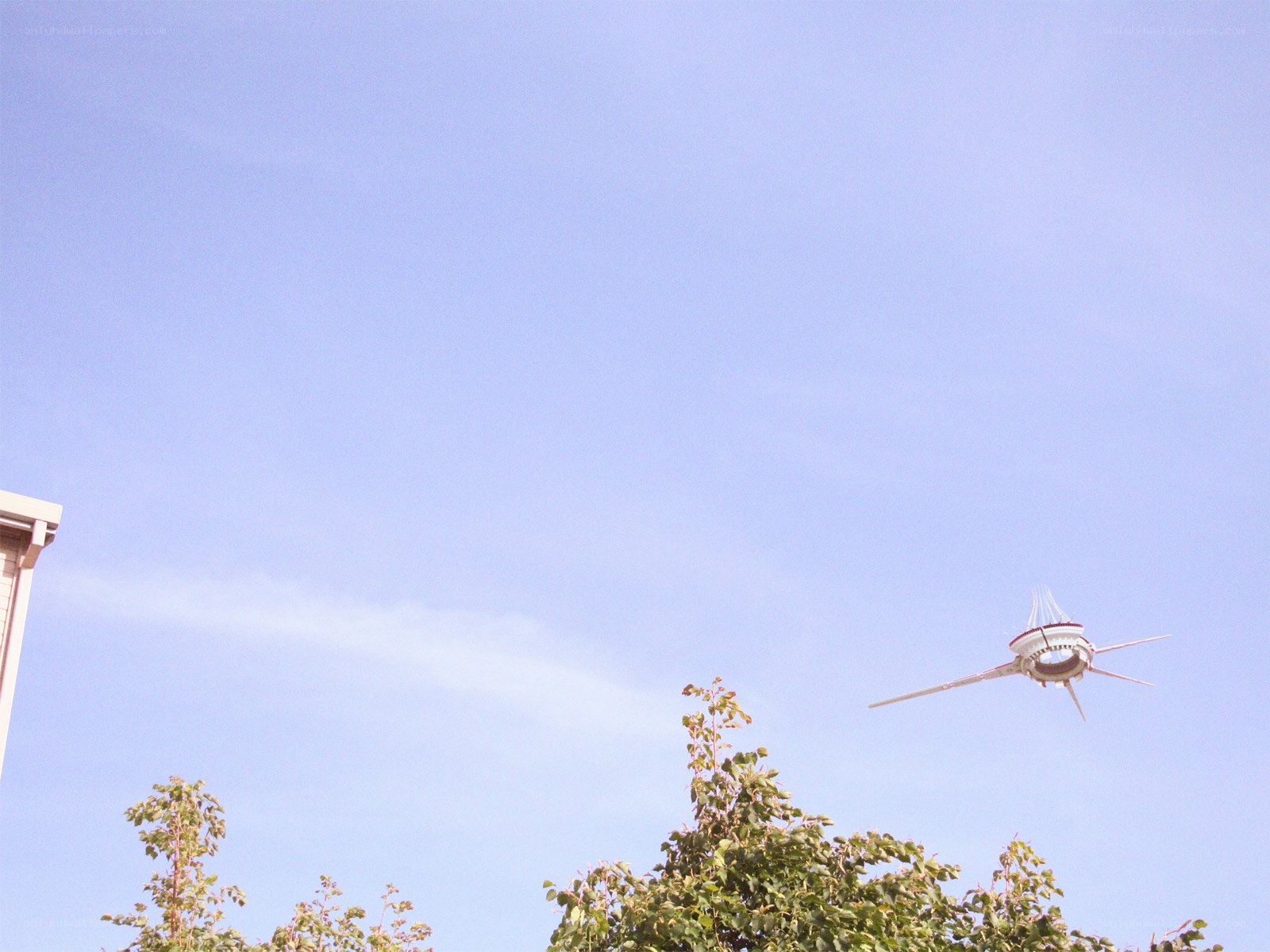 Futuristic aircraft in blue sky