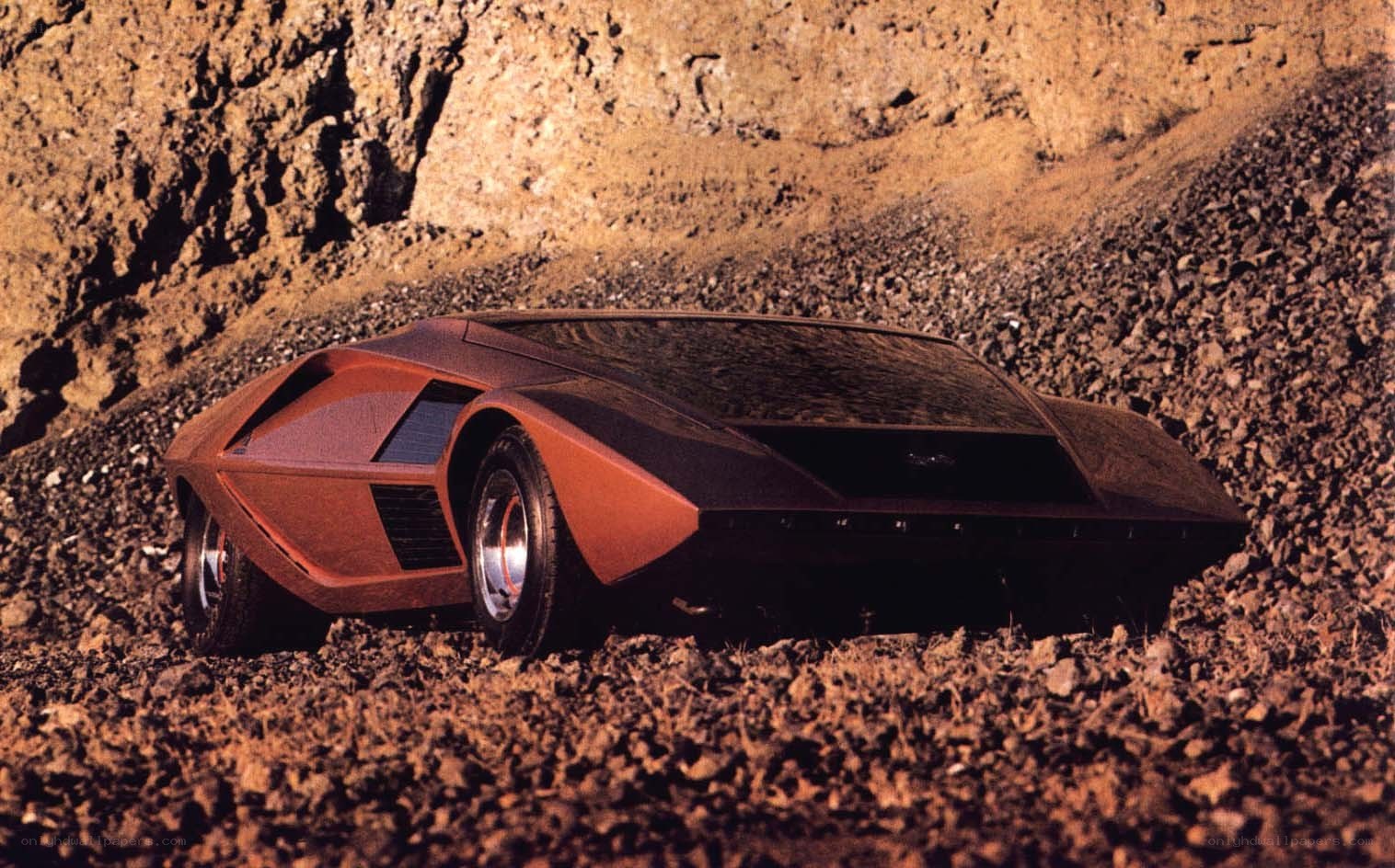 futuristic car on rocky terrain