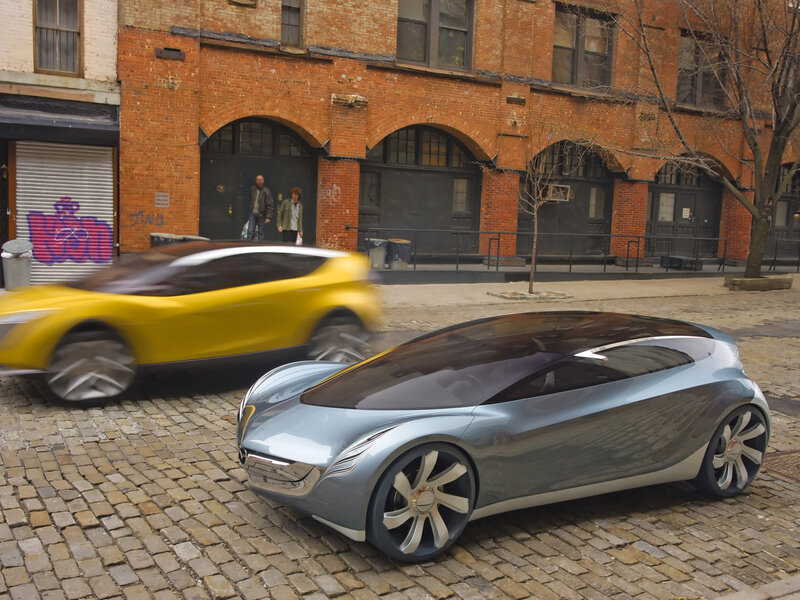 Futuristic cars on a cobblestone street