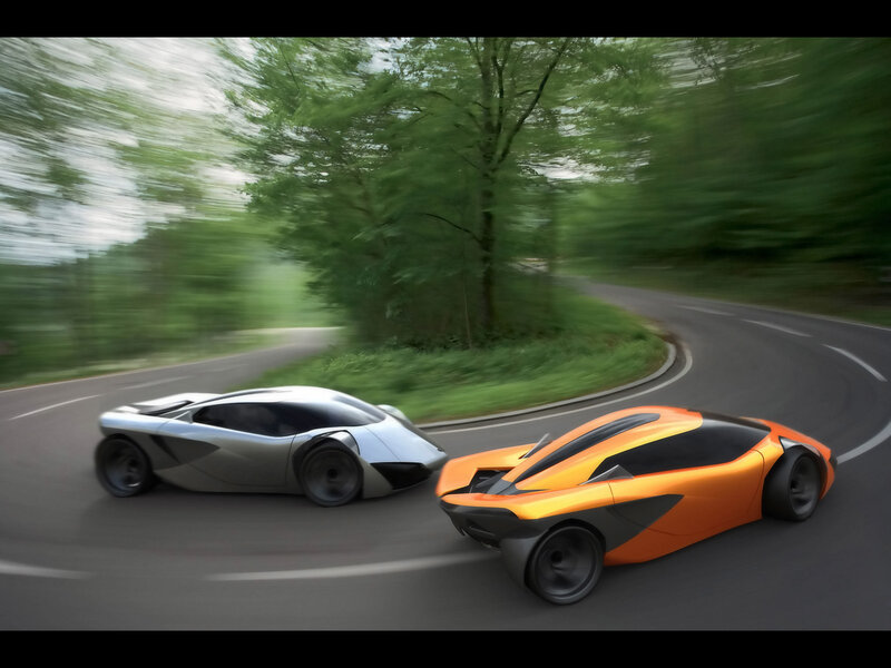 Futuristic cars on a winding road