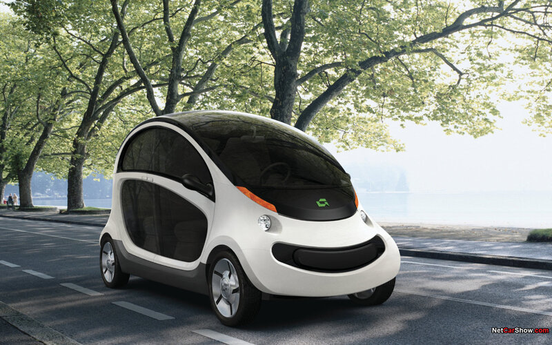 Futuristic electric car on a tree-lined road