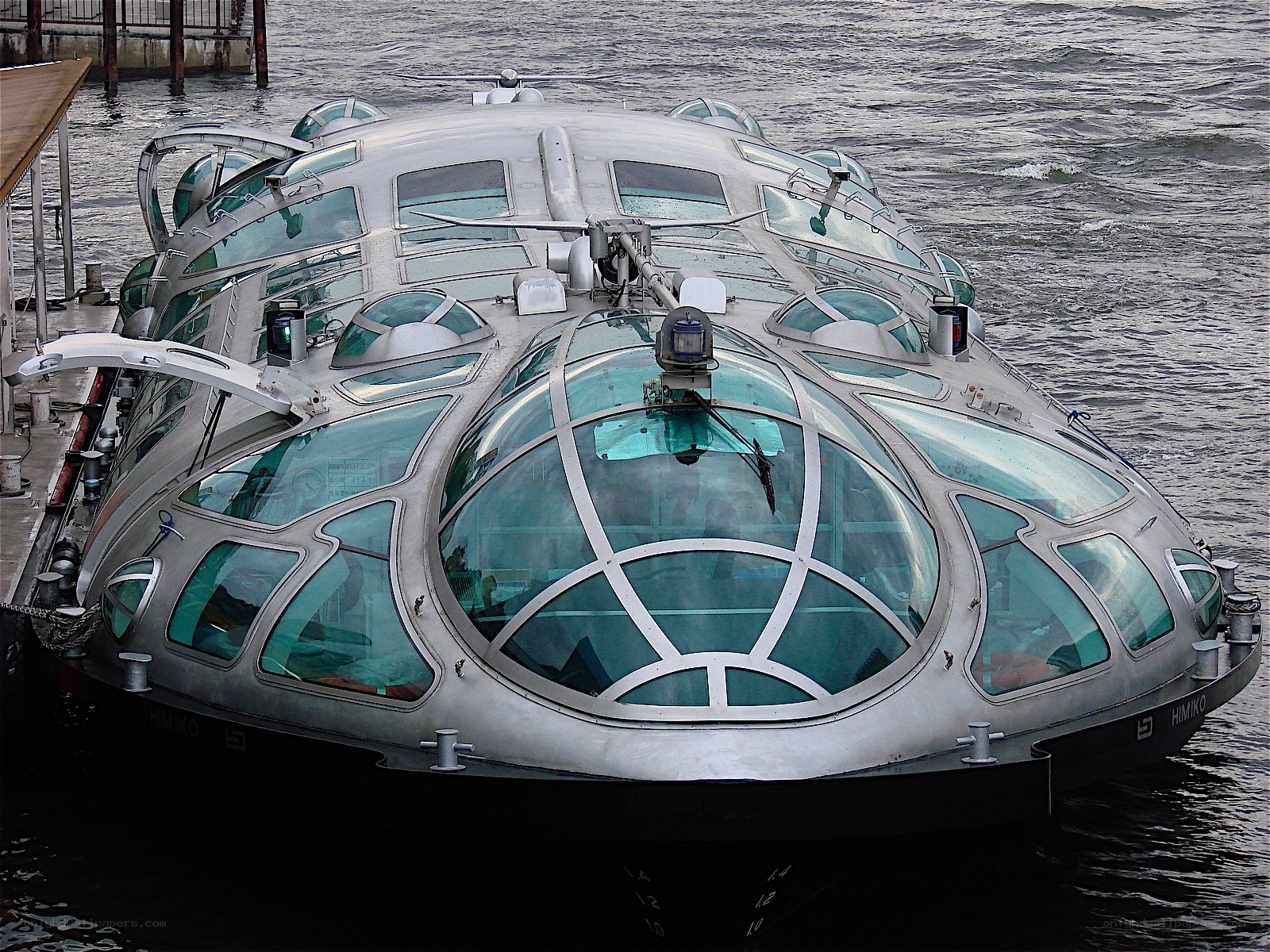 futuristic glass boat at dock