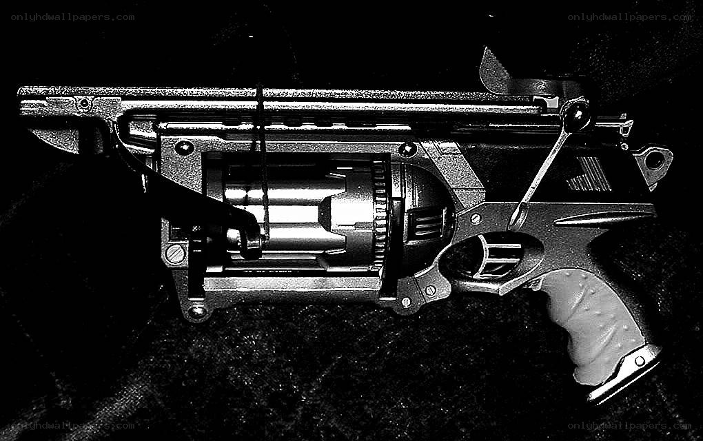 futuristic revolver with exposed cylinder