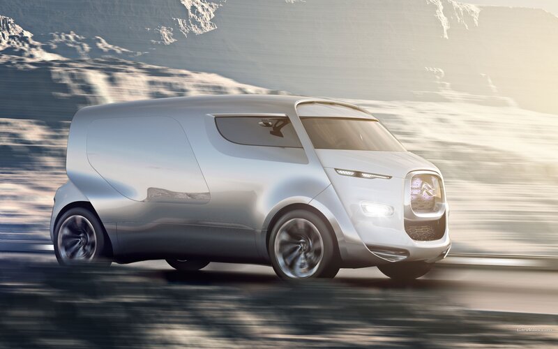 futuristic silver van in motion