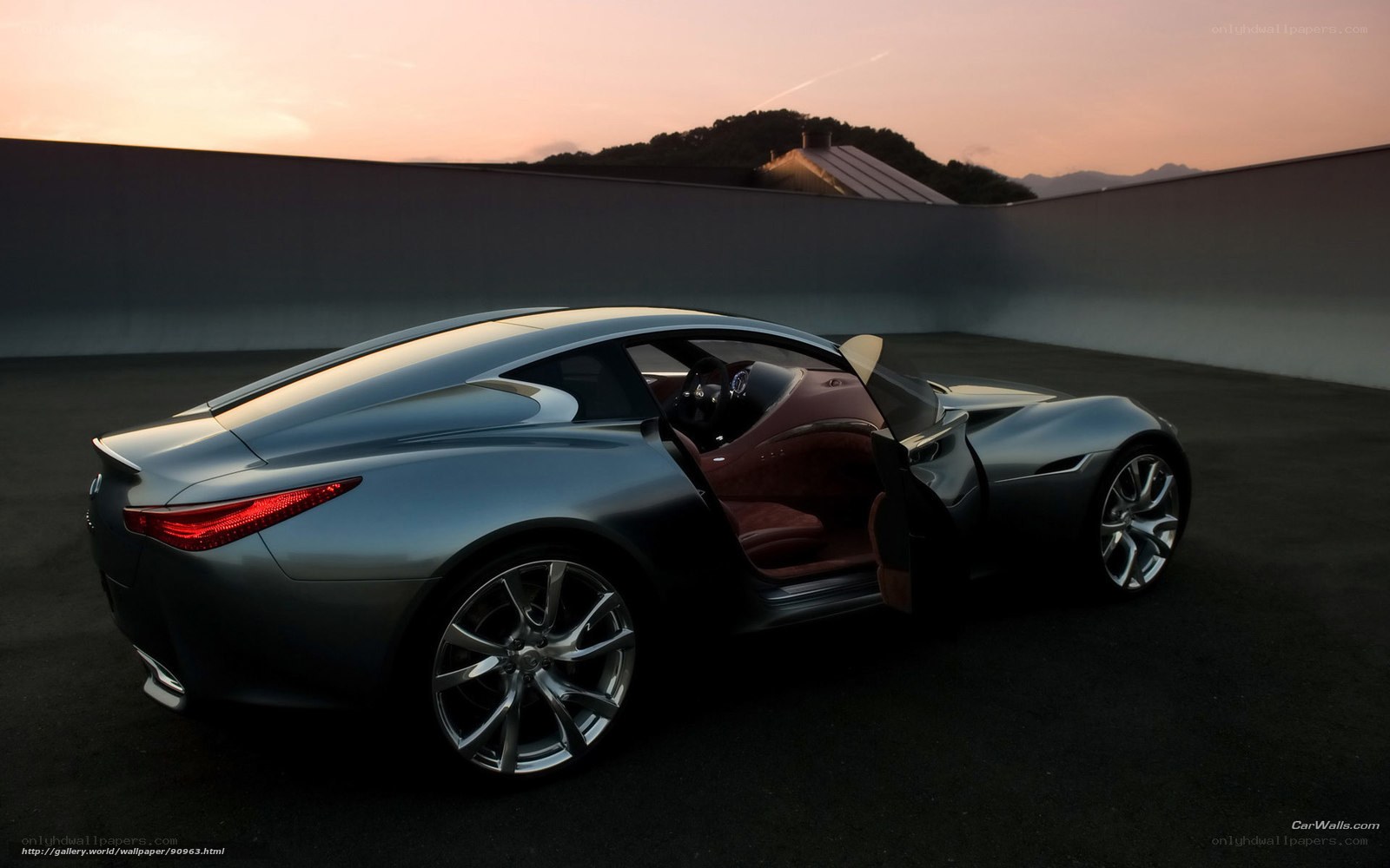 Futuristic sports car at sunset