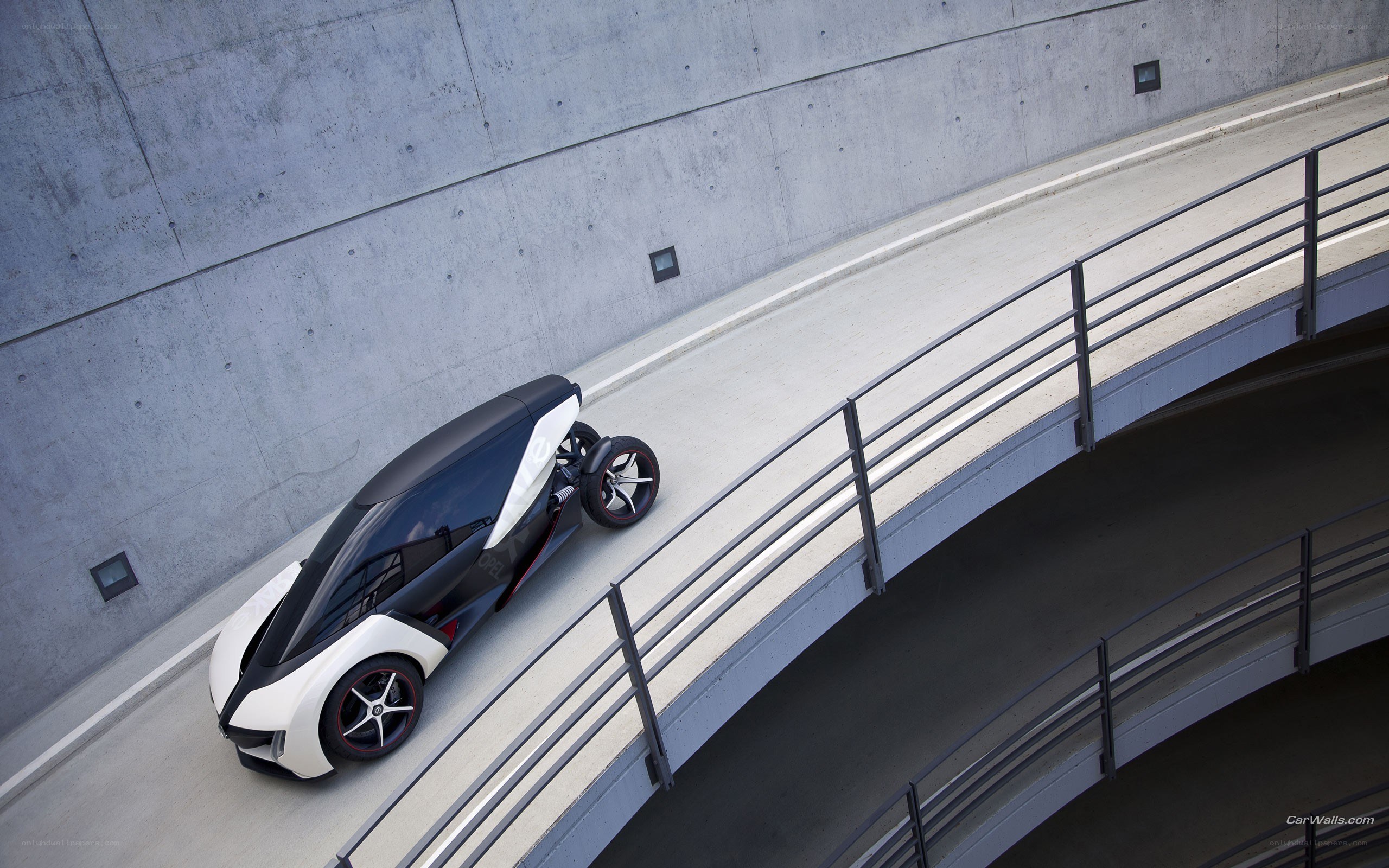 futuristic three-wheeled car on ramp