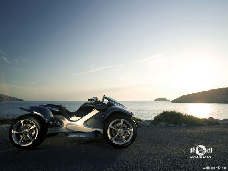 Futuristic three-wheeled motorcycle by sea