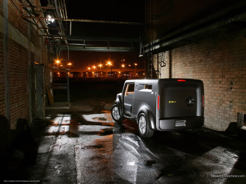 Futuristic van in alley at night