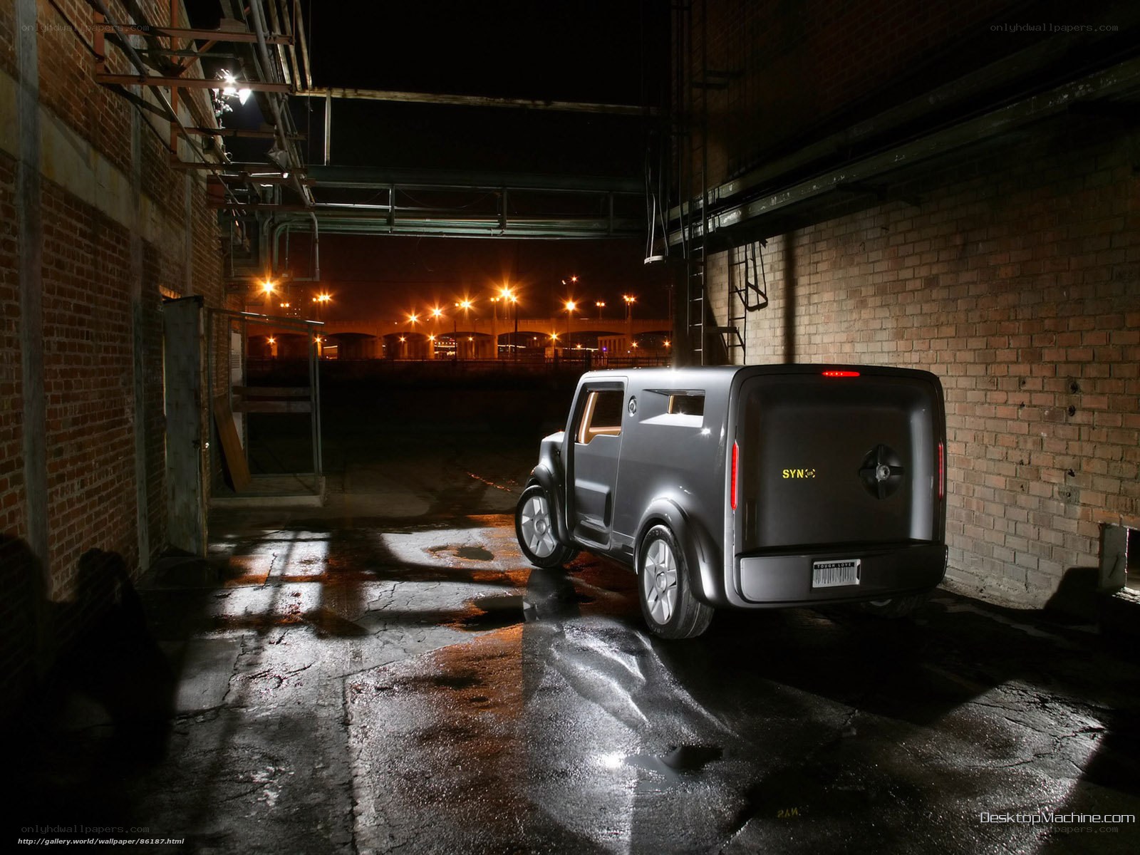 Futuristic van in alley at night