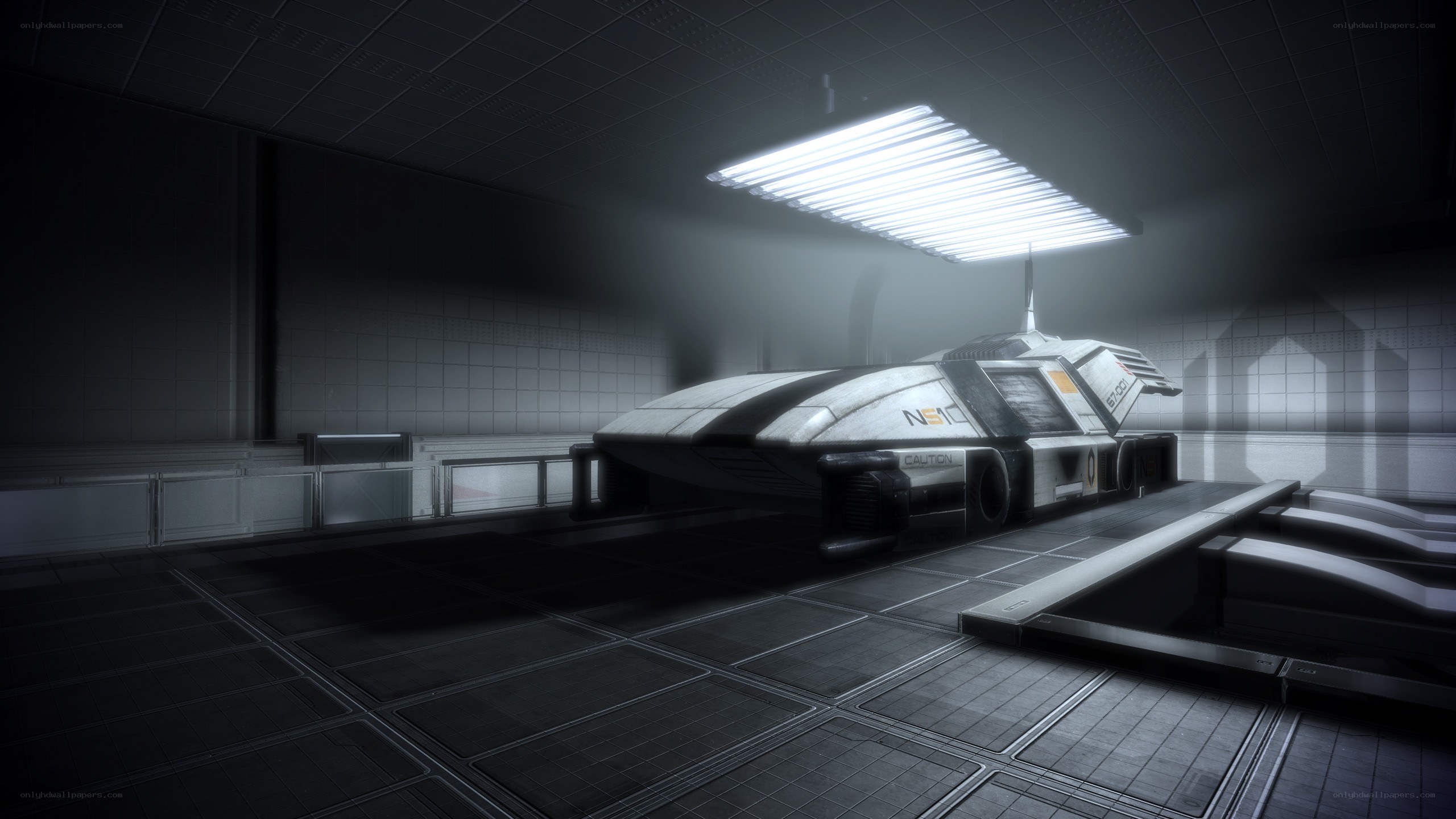 futuristic vehicle in a hangar