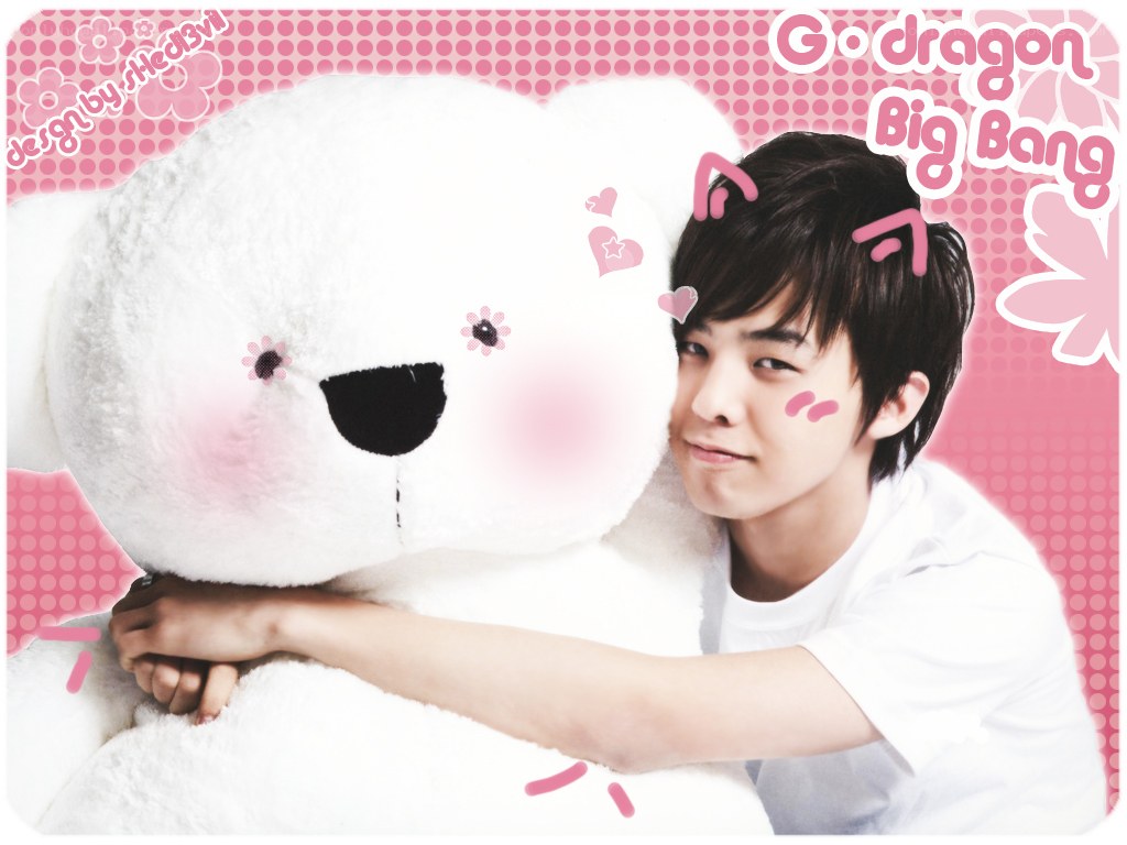 G-Dragon hugging a teddy bear