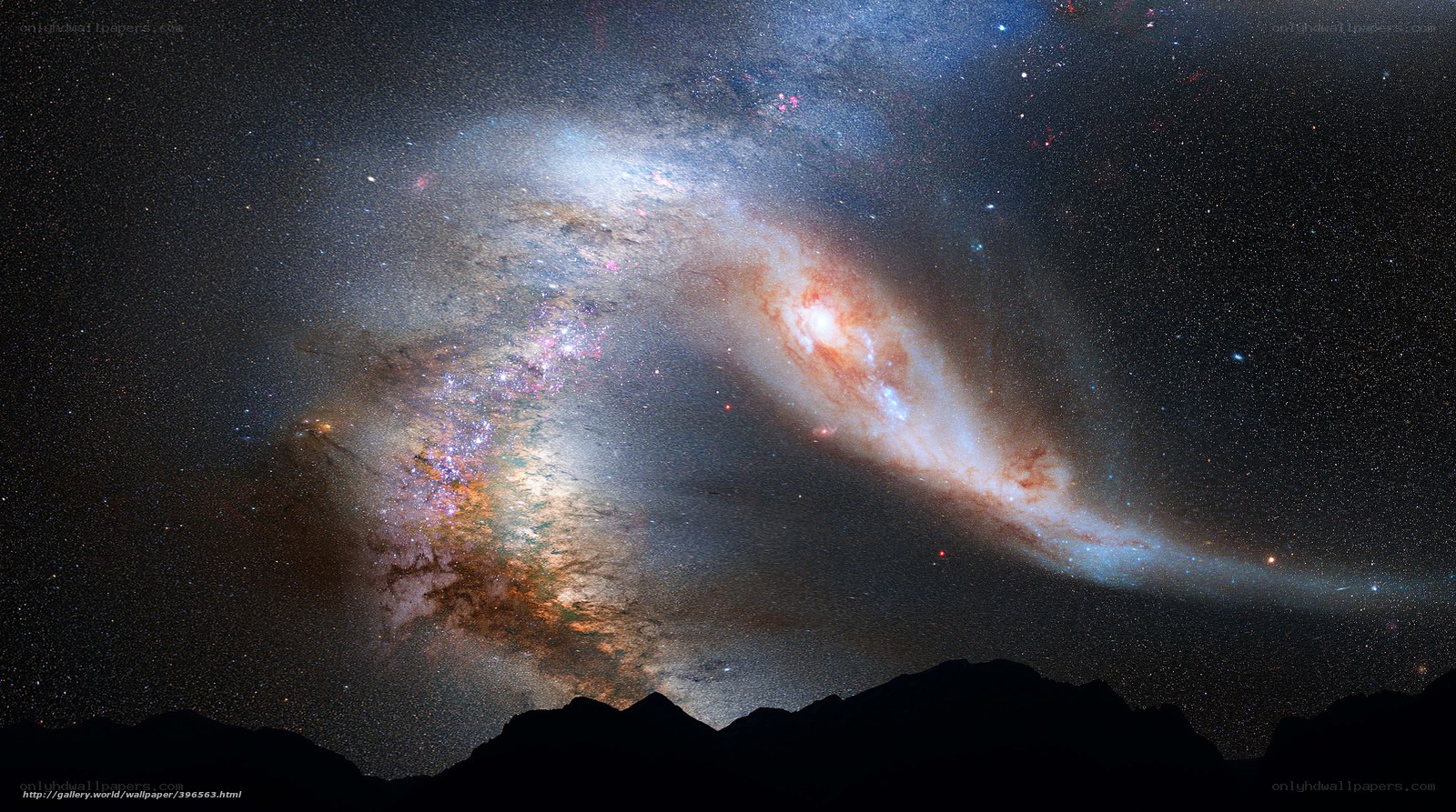 Galaxy over mountain silhouette