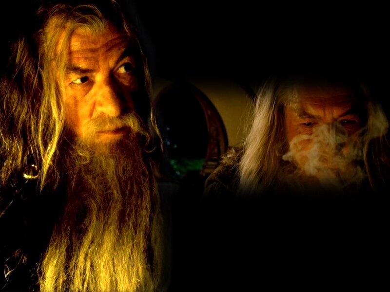 Gandalf and Bilbo in a dimly lit scene