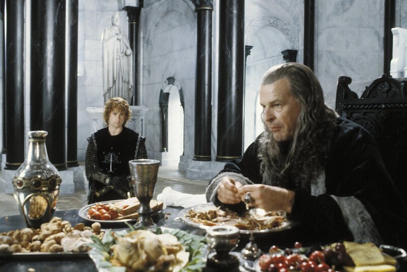 Gandalf and Merry at a feast