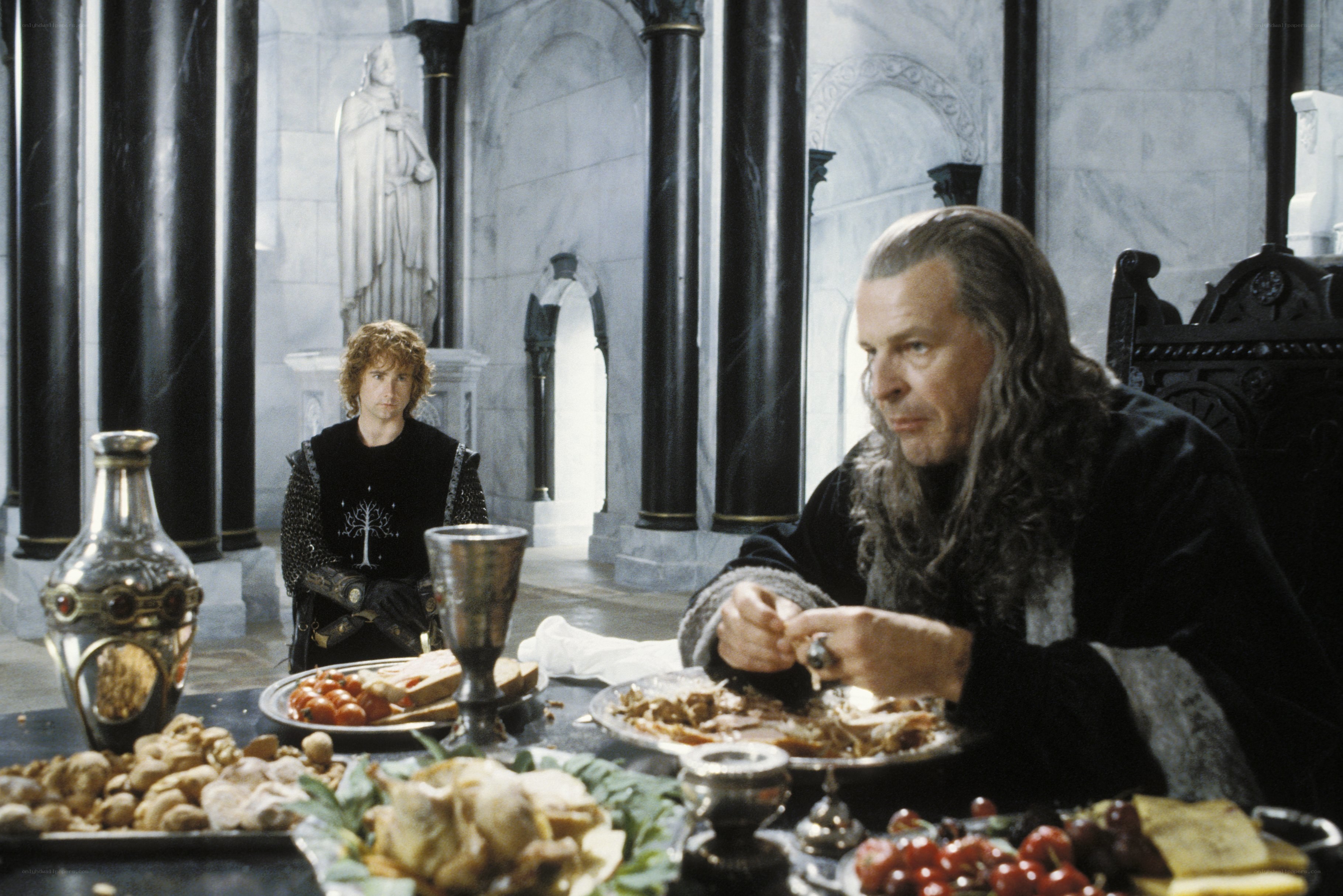Gandalf and Merry at a feast