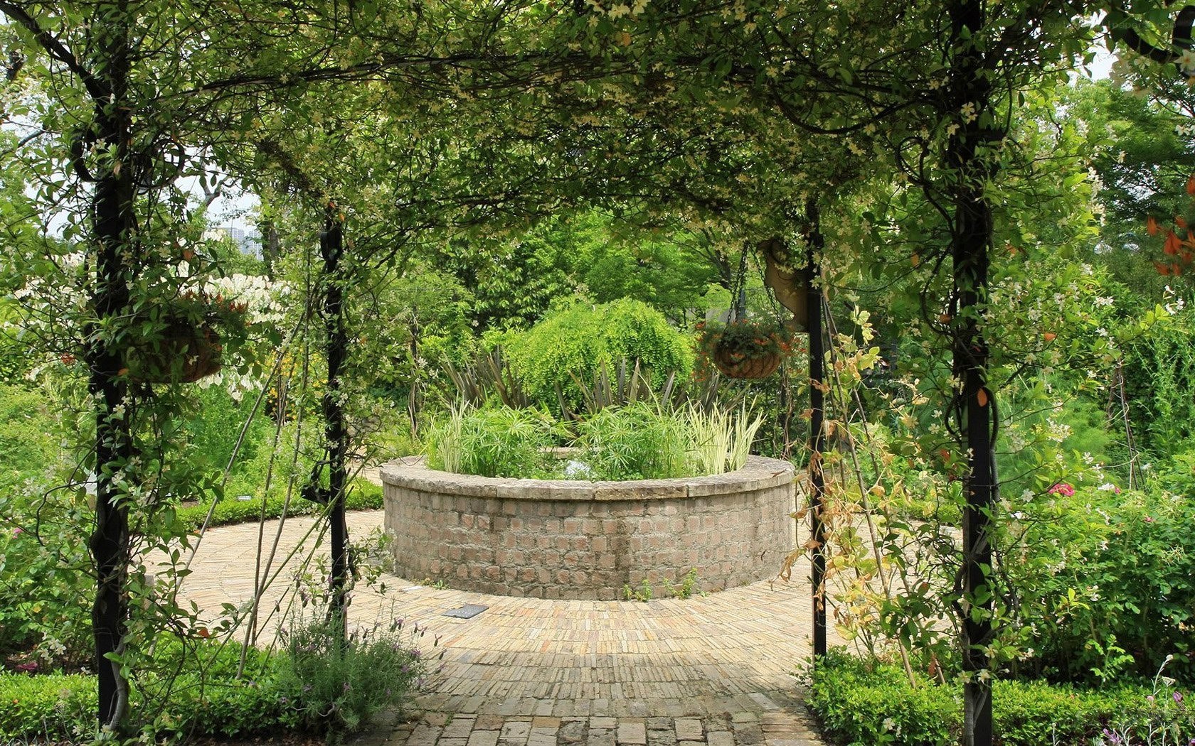 Garden arbor with stone planter