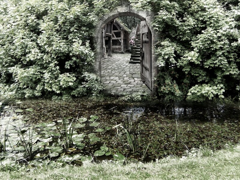 Garden archway with pond