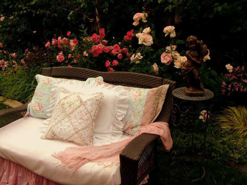 Garden bench with floral pillows