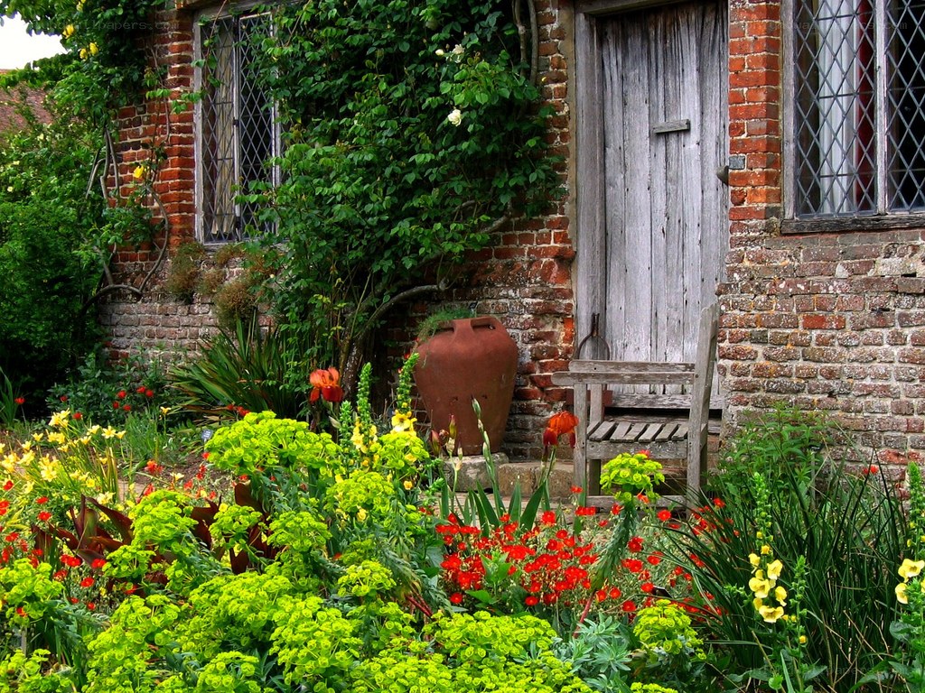 Garden by a brick cottage