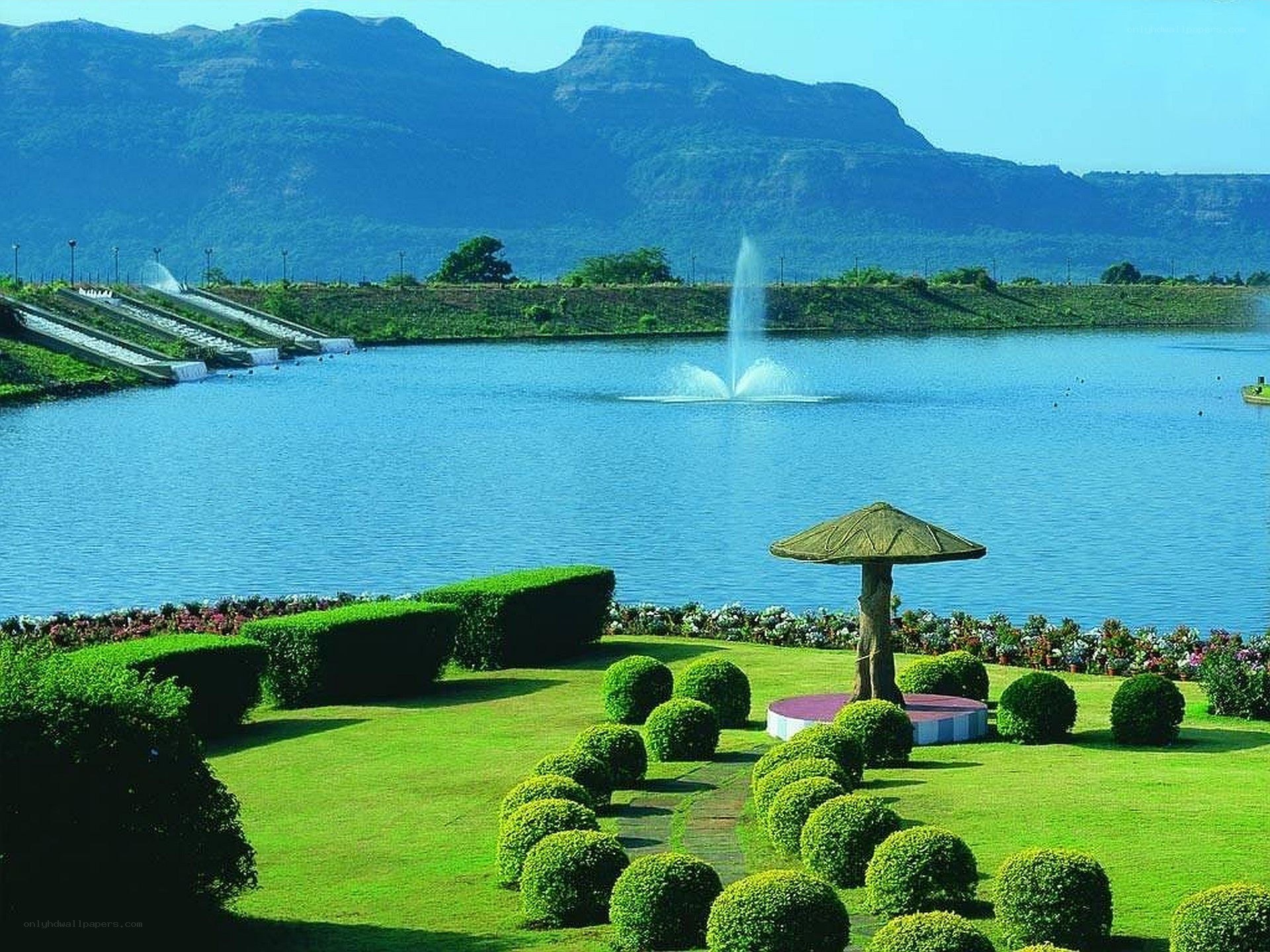 Garden by the lake with mountains