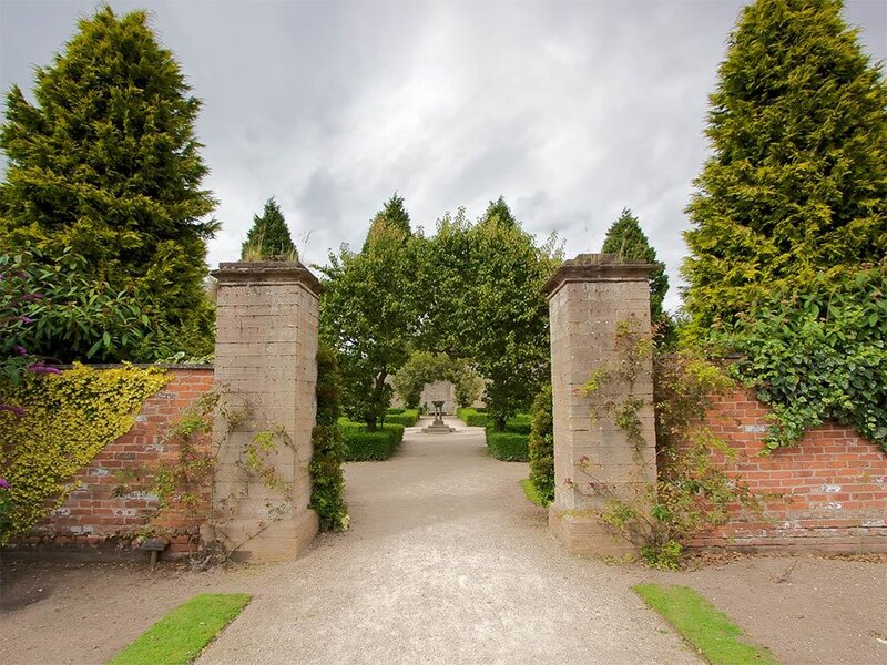garden entrance with stone pillars