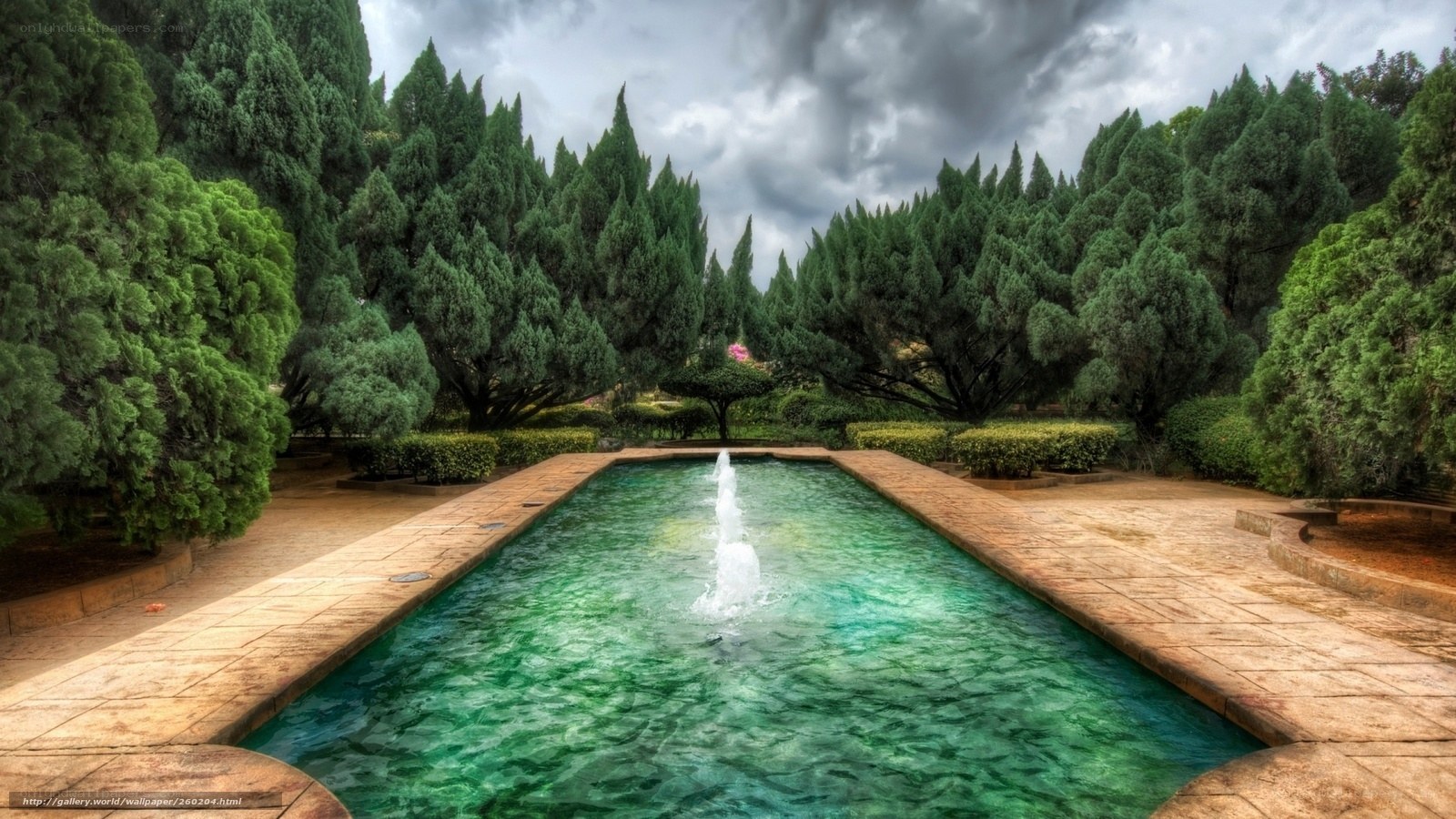 Garden fountain under cloudy sky
