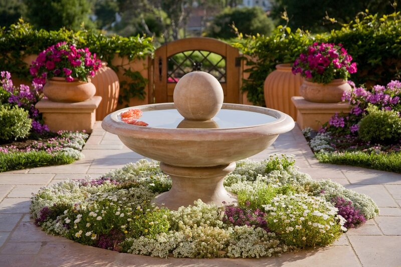 Garden fountain with flowers