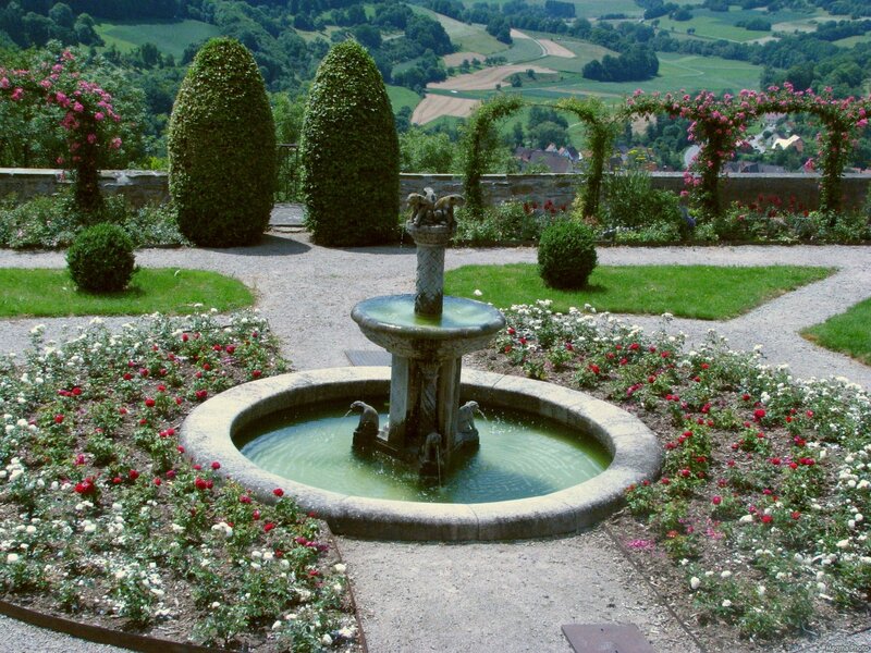 Garden fountain with rose arches