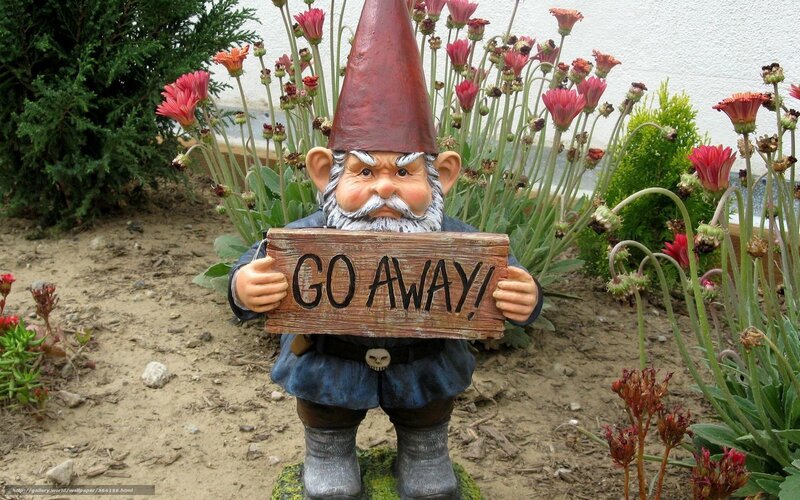 Garden gnome with 'Go Away' sign