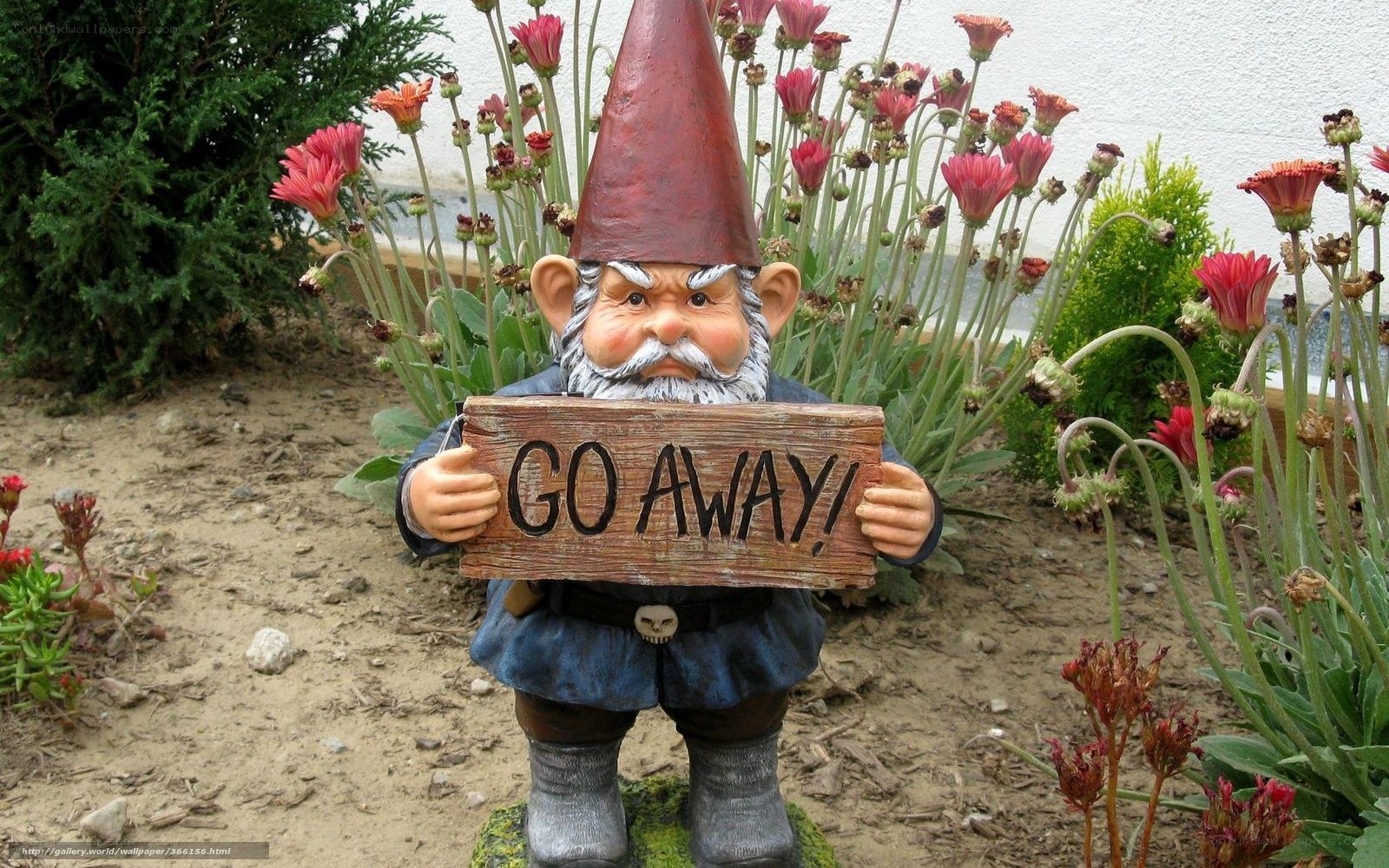 Garden gnome with 'Go Away' sign