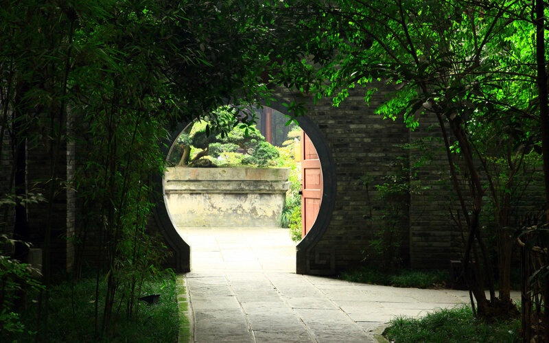 Garden path through arched gate