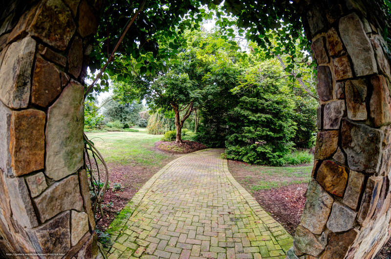 Garden path through stone arch